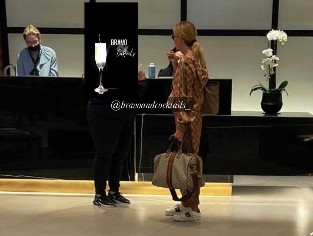 screenshot of two people in a hotel