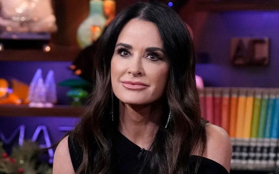 Kyle Richards smirks during an appearance on WWHL
