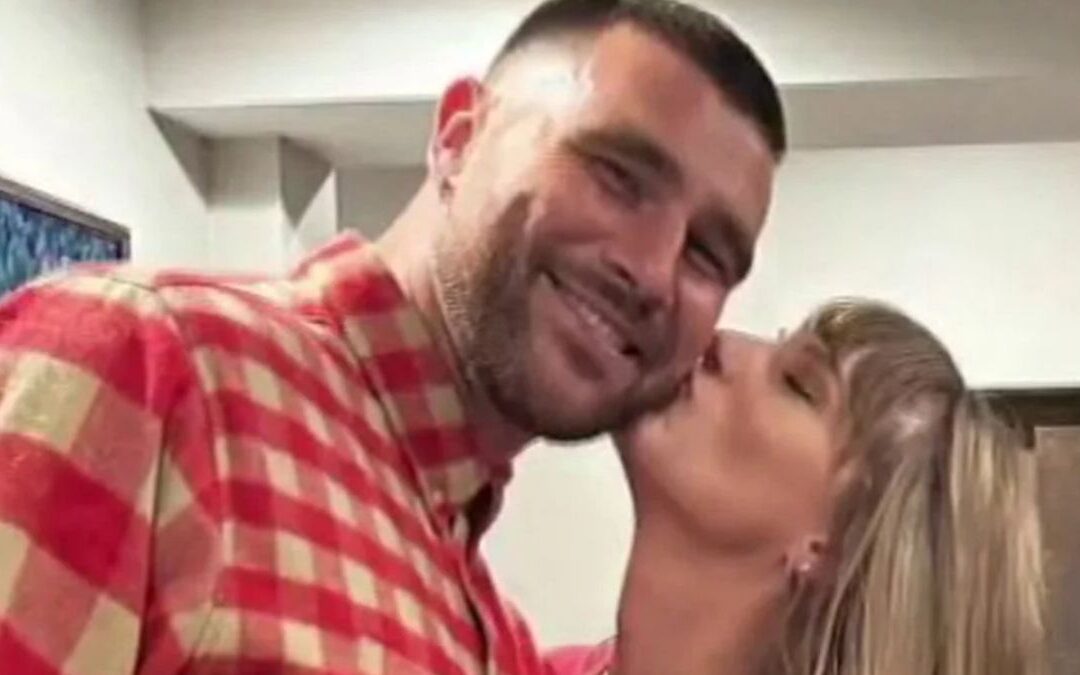 Taylor Swift kissing Travis Kelce on the cheek